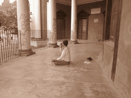A MAN DOING EXERCISE AT CORRIDOR OF PATNA UNIVERSITY. SHOT AT MORNING HOURS ON 03 NOVEMBER 2012 AT  PATNA, BIHAR, INDIAのeditorial素材