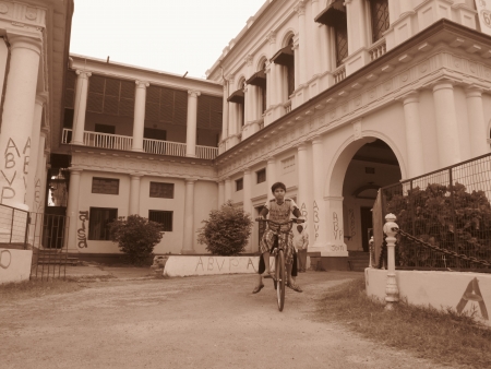 CHILDREN RIDING BICYCLE AT PATNA UNIVERSITY. SHOT AT MORNING HOURS ON 03 NOVEMBER 2012 AT  PATNA, BIHAR, INDIAのeditorial素材