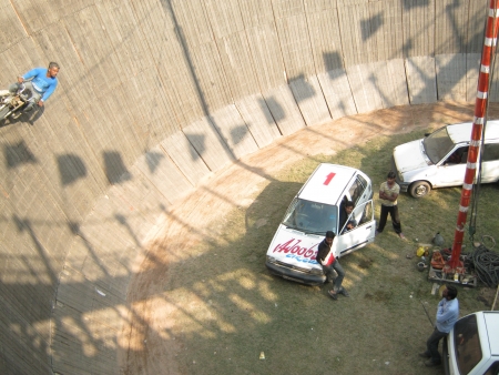 BIKE STUNT AT FAIR.SHOT DURING AFTERNOON HOURS ON 02.12.12 AT SONEPUR FAIR, SONEPUR, BIHAR, INDIA.のeditorial素材