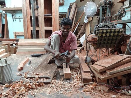 UNIDENTIFIED WORKER AT CARPENTER SHOP. SHOT AT EVENING HOURS ON MARCH 20, 2013 IN PORT BLAIR, ANDAMAN, INDIA.のeditorial素材