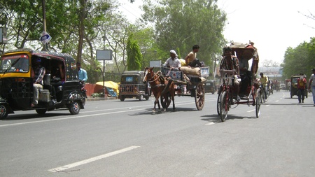 HORSE DRIVEN TANGA IN STREET. SHOT AT AFTERNOON HOURS ON APRIL 05, 2013 IN PATNA, INDIA.