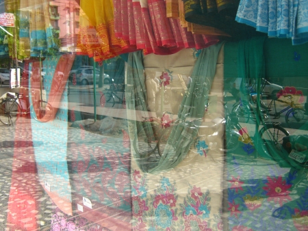 CLOTHES BEING DISPLAYED BEHIND GLASS の写真素材