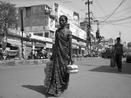 WOMAN CARRY BANGLES, A RARE SCENERY IN INDIA. SHOT AT MORNING HOURS ON APRIL 18, 2013 IN PATNA, BIHAR, INDIA.のeditorial素材