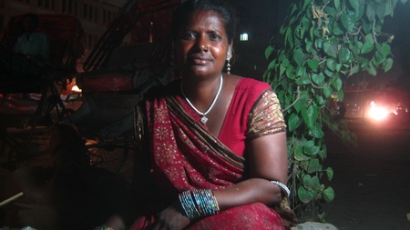 PORTRAIT OF A POOR COMMON INDIAN SHOPKEEPER WOMAN VENDOR. SHOT DURING EVENING HOURS ON APRIL 18, 2013 IN PATNA, INDIA.のeditorial素材