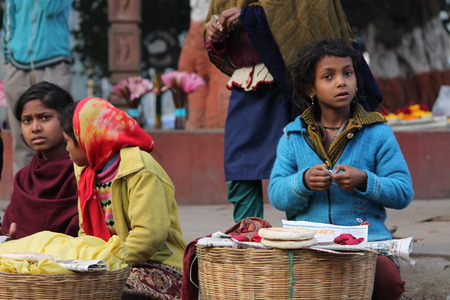 Woman sale food on road. Shot at Bodhgaya, India, afternoon hours on 26.12.14のeditorial素材