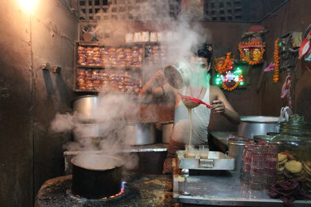Milkman boils milk before sale. Travel Patna Junction. Shot at Patna Junction, Patna, Bihar on 04.02.2015. Evening hours.のeditorial素材