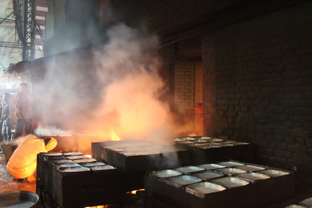 Milkman boils milk before sale. Travel Patna Junction. Shot at Patna Junction, Patna, Bihar on 04.02.2015. Evening hours.のeditorial素材