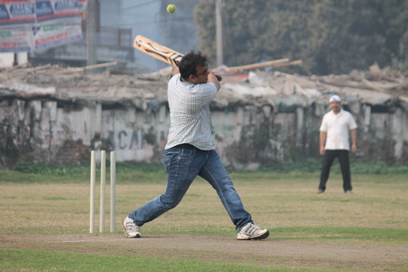 Reserve Bank of India Officers play friendly cricket. Shot at morning hours on 21.02.2015 at Patna, Bihar, India.のeditorial素材