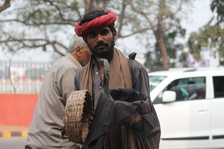 Snake catcher. Street photo, Shot at Gandhi Maidan, Patna, Bihar, India on 25.02.15 at afternoon hours.のeditorial素材