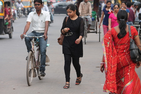 Woman returns home. Street photo, Shot at Gandhi Maidan, Patna, Bihar, India on 25.02.15 at afternoon hours.のeditorial素材