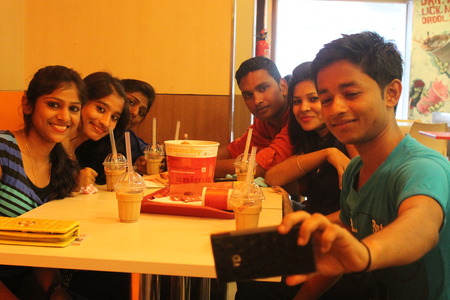 Selfi at a KFC outlet. Shot on 01.03.15, afternoon hours at Patna, India.のeditorial素材