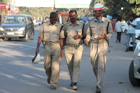 Police on road. Street photo. Shot at Gandhi Maidan, Patna, India at afternoon hours on 11.03.15.