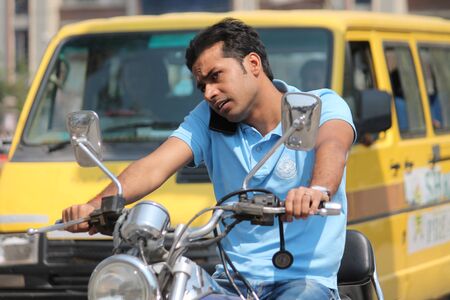 Unsafe driving. Shot at Gandhi Maidan ,Patna, India at afternoon hours on 13.03.15.のeditorial素材