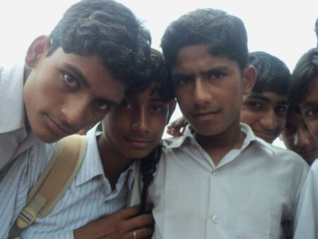 School boys face camera. Shot at morning hours at Jalaun district, Uttar Pradesh, India on  March 01, 2010.のeditorial素材