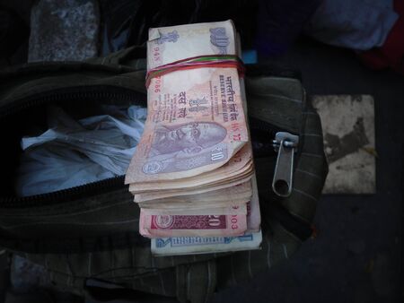 Money on sale at Holi at Kolkata, India. March 2017.