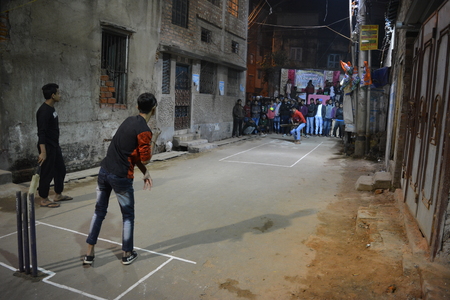 Gully or street cricket played in Kolkata, India evening on January 06, 2017.のeditorial素材