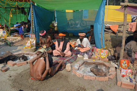 Kolkata, India. 08th January 2018. Naga Sadhus, devotees and rituals at Ganga Sagar Shivir, Outram Ghat transit camp for Ganga Sagar Mela 2018.のeditorial素材