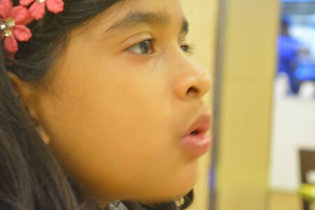 Indian girl eats Pizza. Jan 2018.の写真素材