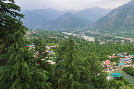 panorama of beautiful small mountain town naggar in summer in kullu valley, located on the foothills of himalaya mountains in himachal pradesh, indiaの写真素材