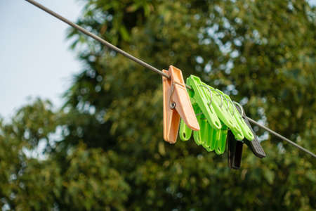 A close up shot of plastic cloth clips. These cloth clips prevent cloths from winds.の写真素材
