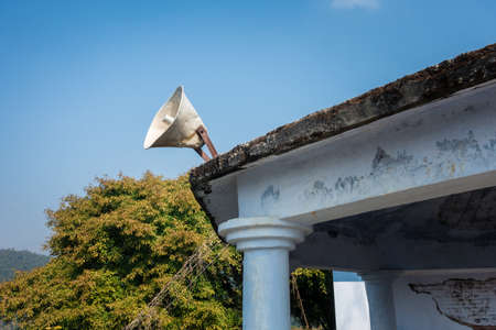A loud speaker on a building roof of a worshiping place. Uttarakhand India.
