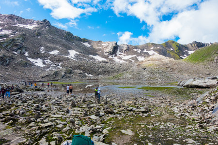 July 14th 2022, Himachal Pradesh India. Devotees offering their prayers at the Nain Sarovar lake during Shrikhand Mahadev Kailash Yatra in the Himalayas.のeditorial素材
