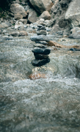 Shiva Linga crafted from pebbles and rocks, placed in a river stream at Kinner Kailash Yatra in Himachal Pradesh, a Hindu pilgrimageの写真素材