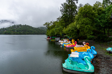 Aug2nd2024, Uttarakhand India. Empty boats lined up on the lakeside at Naukuchiatal Lake during the monsoon season, an off-season period for tourists in Almora, Uttarakhand, India.の写真素材