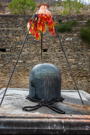 Feb.18th 2024, Uttarakhand India. Granite stone Shivalinga's at Lakhamandal Shiva Temple. It shines like a mirror and reflects the surrounding view.の写真素材