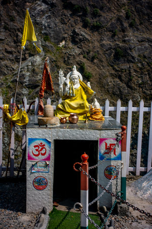 July25th2024, Himachal Pradesh, India. A white Lord Shiva sculpture covered in yellow cloth and...