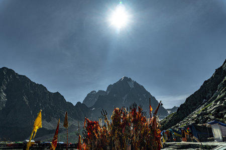 July25th2024, Himachal Pradesh, India. Religious red cloths (chunri) and tridents (trishul), symbols...