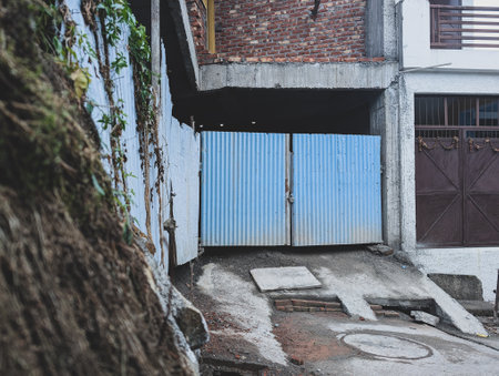 An outer locked metal gate of an under construction building in Dehradun, India.の写真素材
