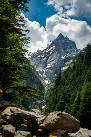 Twin peaks in Harsil Valley, Uttarkashi, with a glacial river flowing to Bhagirathi, a main Ganga...