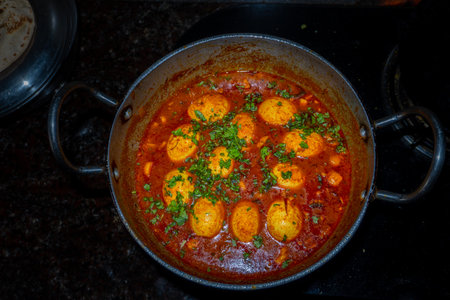 A rich, flavorful homemade egg curry in an Indian household,