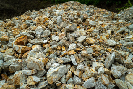 Close-up of solid aggregates and river rocks used for landslide control and road safety in...