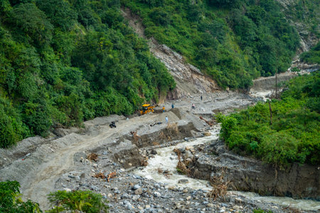 September20th2025 Dehradun Uttarakhand, India. Heavy machinery clears landslide debris in monsoon-hit Rajpur, Dehradun, Uttarakhand Himalayasの写真素材