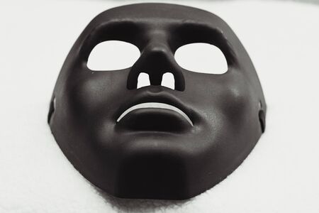 Black mask for Halloween day on white backgroundの写真素材