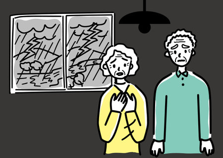 Senior couple uneasy due to power outageのイラスト素材