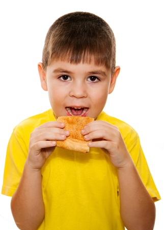 Boy eating pizzaの写真素材