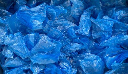 Blue shoe covers. Plastic polyethylene material. Background. Image for the sale and production of objectsの写真素材