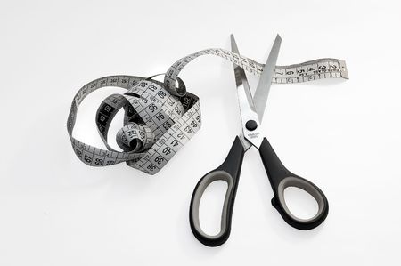Meter studio and cutting scissors. Illustrate to proverb の写真素材