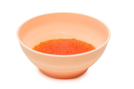 Red caviar in the  container. Isolation on white. の写真素材