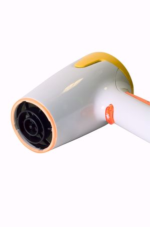 Stylish yellow and orange hairdryer on whiteの写真素材