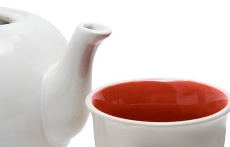 Close-up of teapot and cup on whiteの写真素材