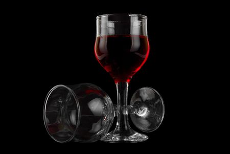 glass of wine on a black isolated backgroundの写真素材