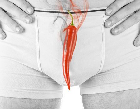 Concept of Red hot chili pepper at man briefs with smokeの写真素材