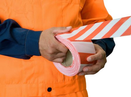 Worker stretch warning tape isolated on whiteの写真素材
