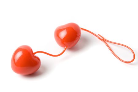 Red vaginal balls as heart isolated on a whiteの写真素材