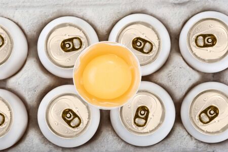 Eggs as aluminum can at the box isolated on a white backgroundの写真素材