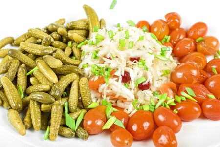 Marinated vegetables closeup at the plate isolated on a white backgroundの写真素材